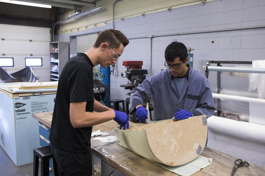 Mechanical engineering technology students working in a lab