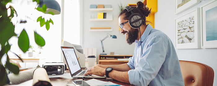 Man sitting at table with laptop