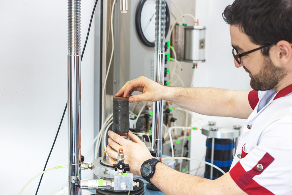 Engineering student in a lab working on the equipment