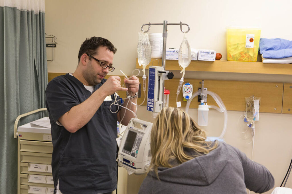 Nursing student practicing techniques in a nursing lab