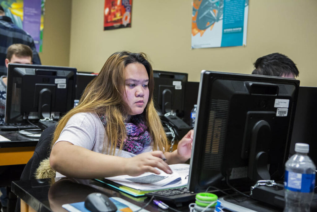 Girl working on a computer in a computer lab