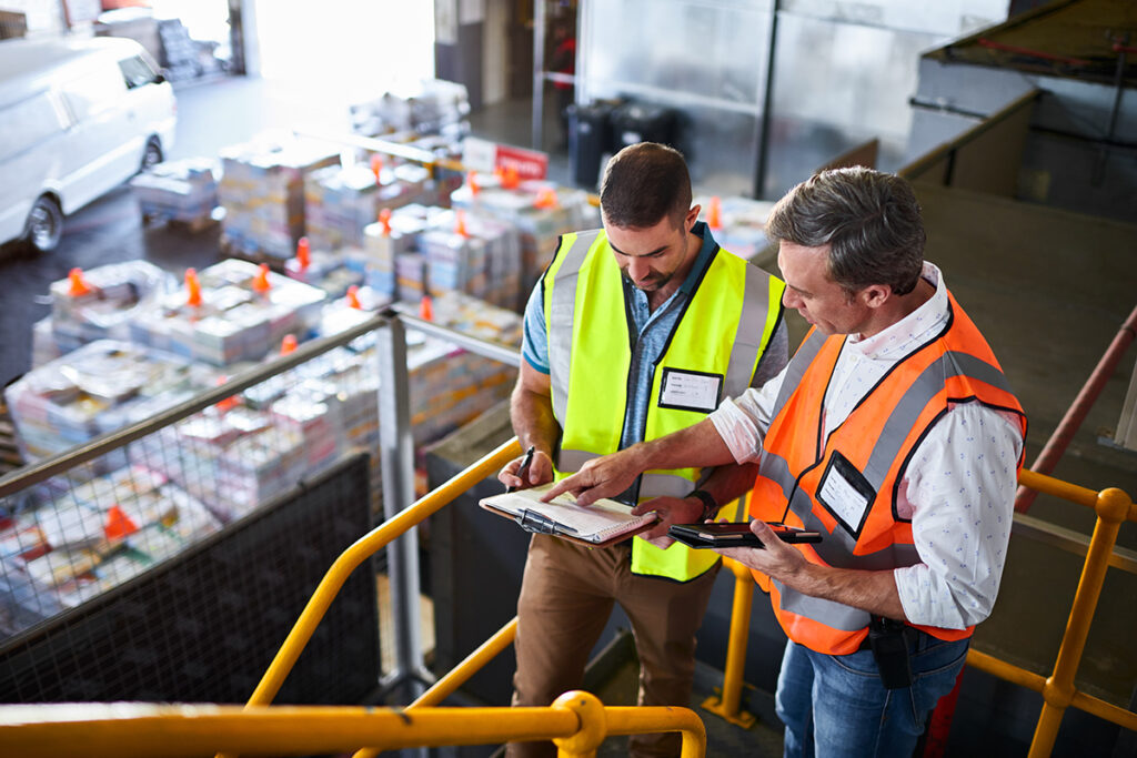 Two men working in a warehouse