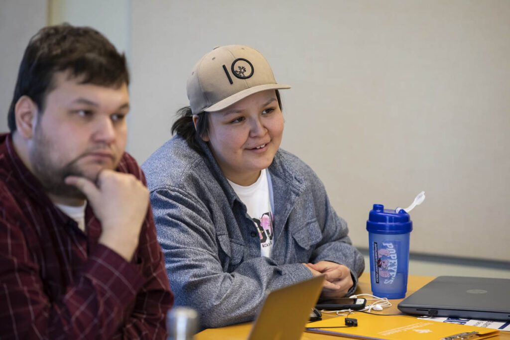 Two students sitting in a classroom