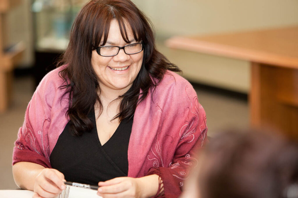 Woman sitting in classroom