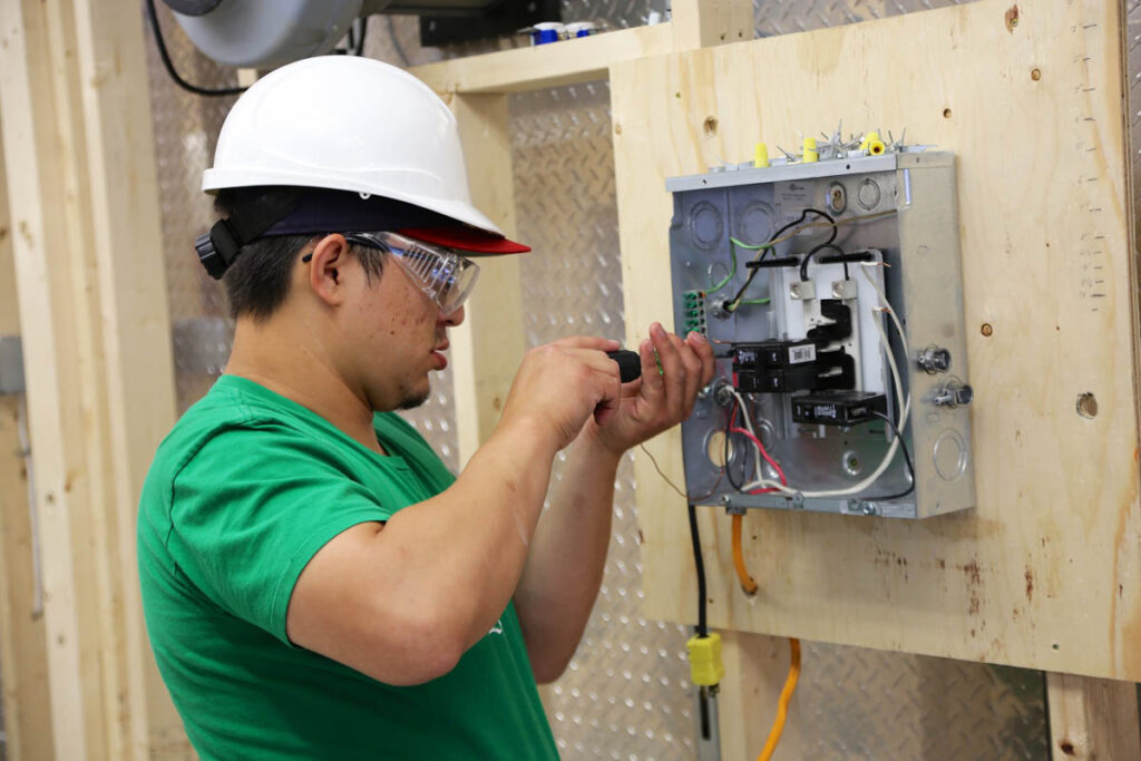 Electrician doing some wiring at construction site