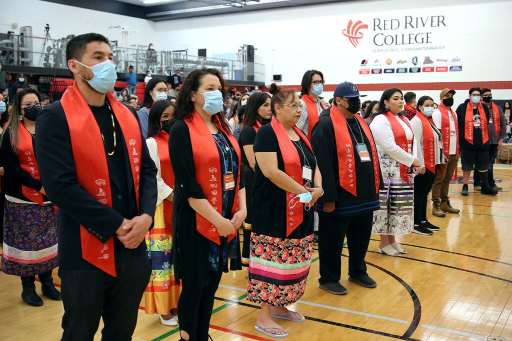 Students graduating at a graduation Pow Wow