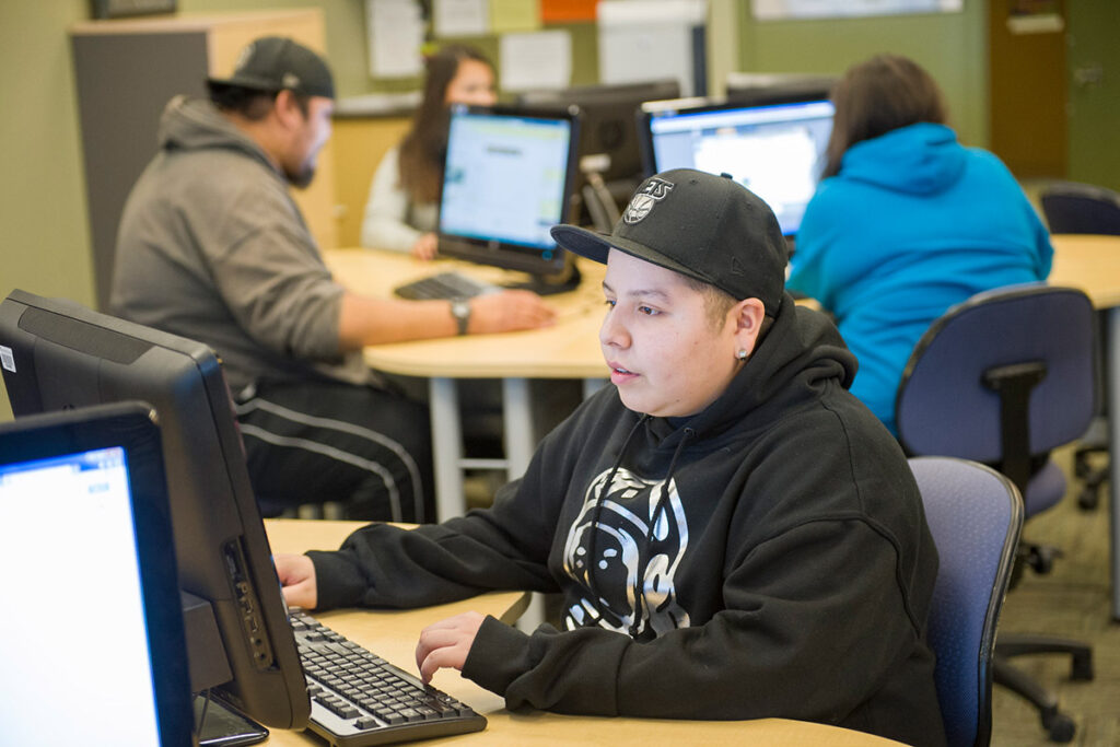 Person working on a computer in a computer lab