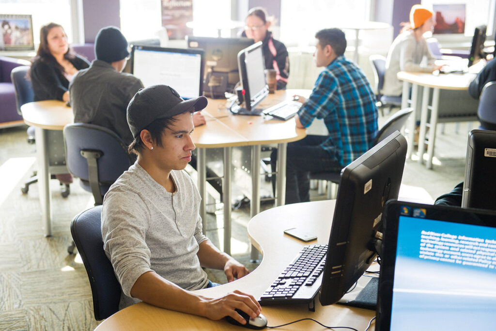 Student working on a computer in a computer lab