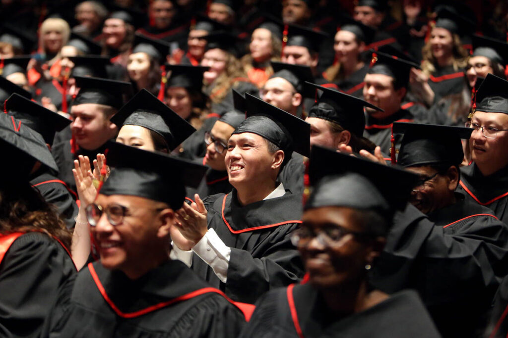 Smiling graduates at convocation ceremony