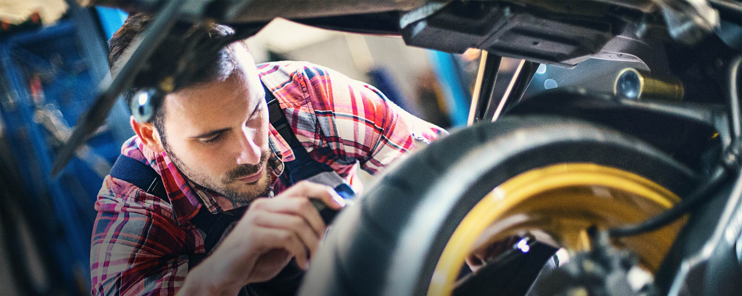 Man working on ATV motor