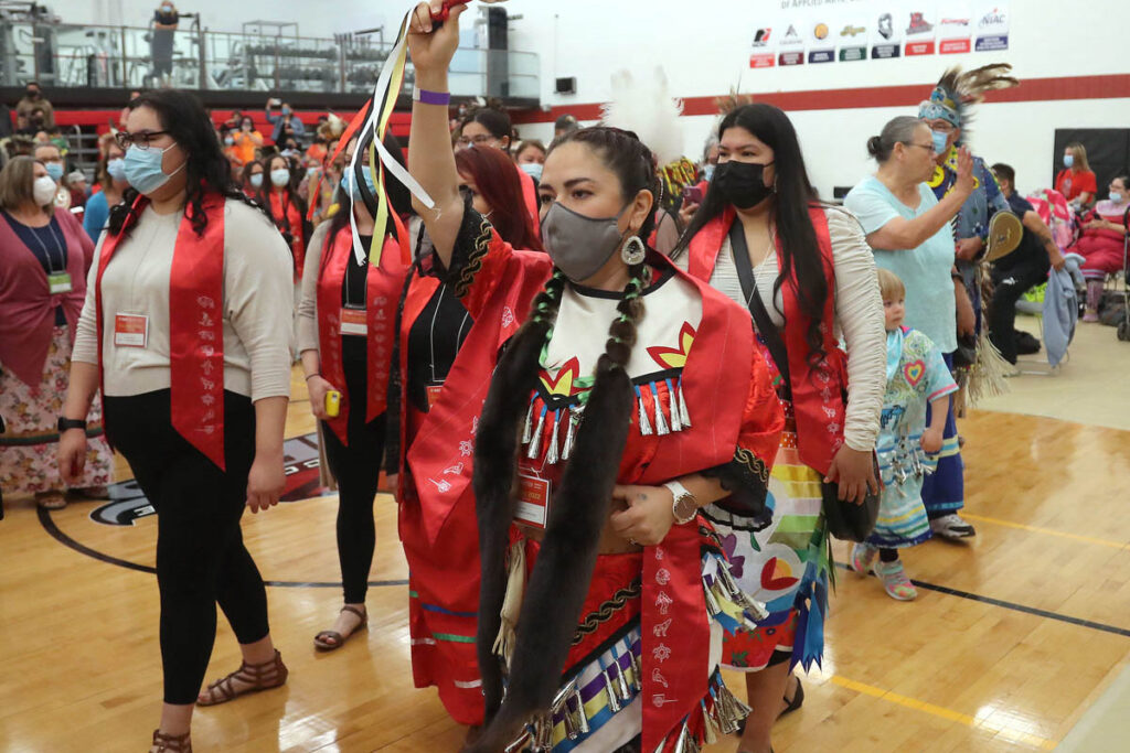 Students celebrating at the graduation Pow Wow