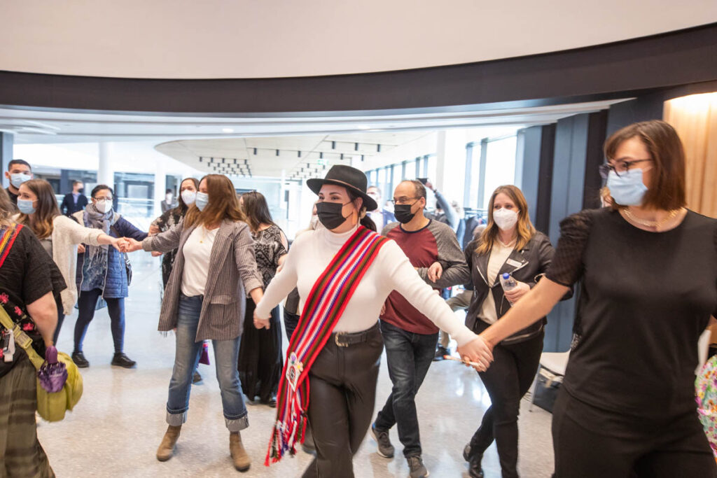 People dancing in the Roundhouse Auditorium at the Exchange District Campus 