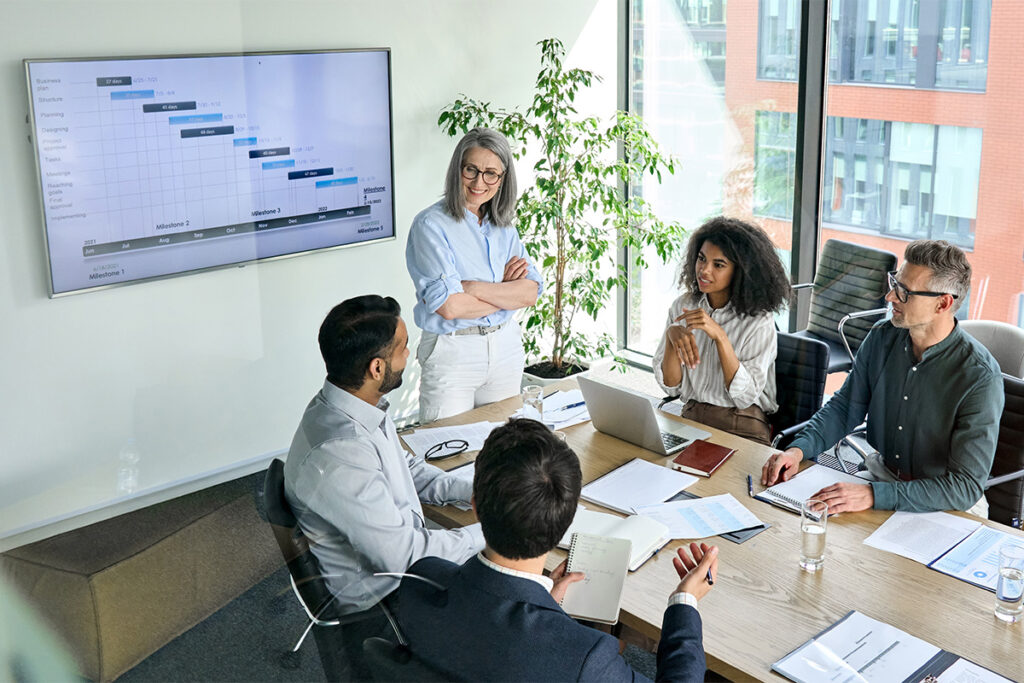 Woman giving a presentation in a boardroom