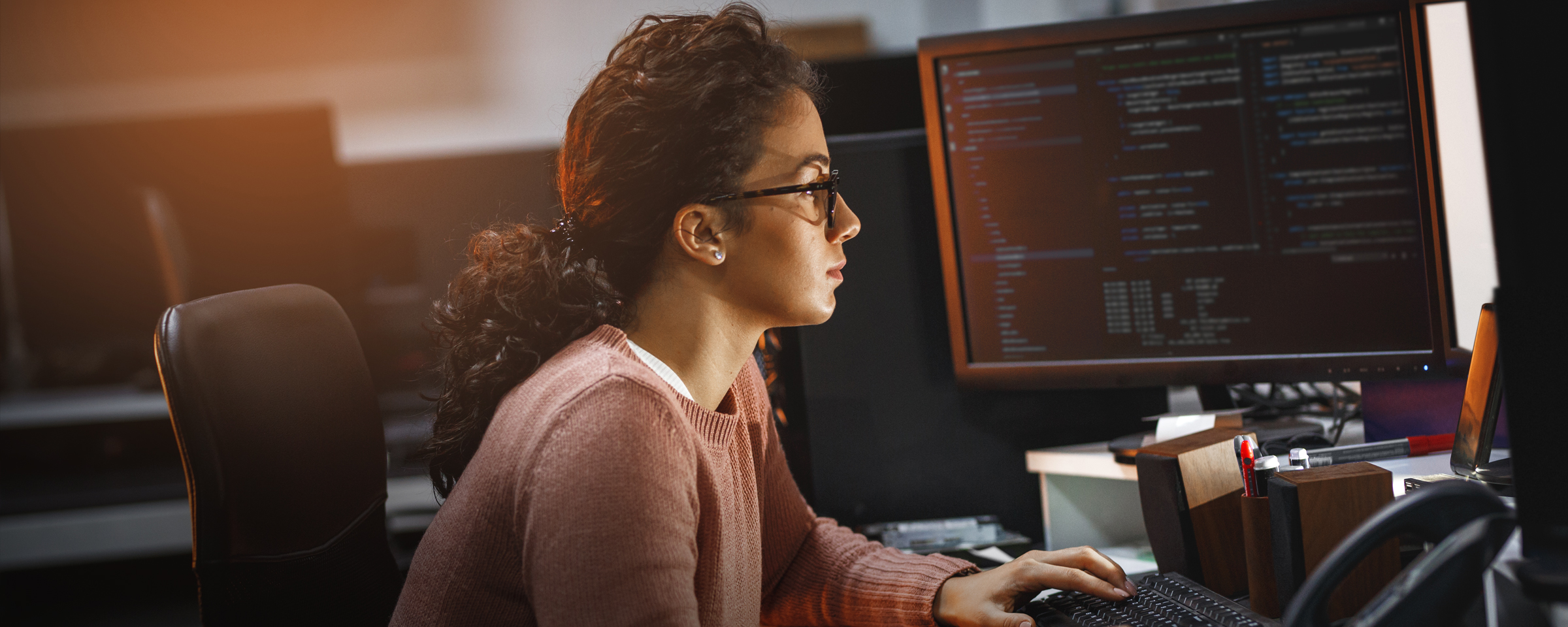 Woman coding on a computer