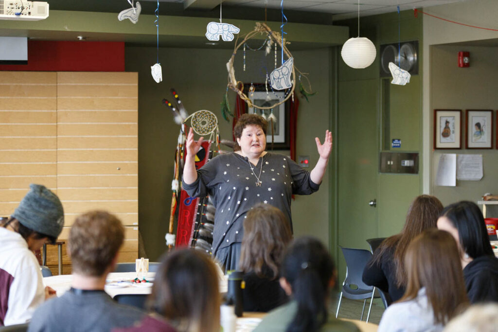 Instructor talking to students in a classroom