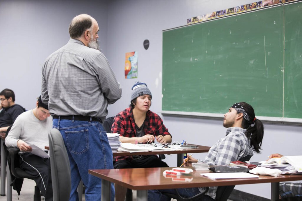 Instructor talking to students in a classroom