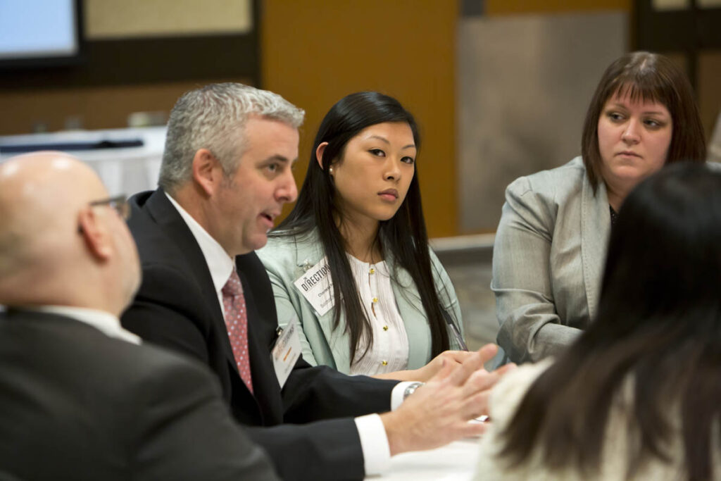 Businesspeople talking at conference