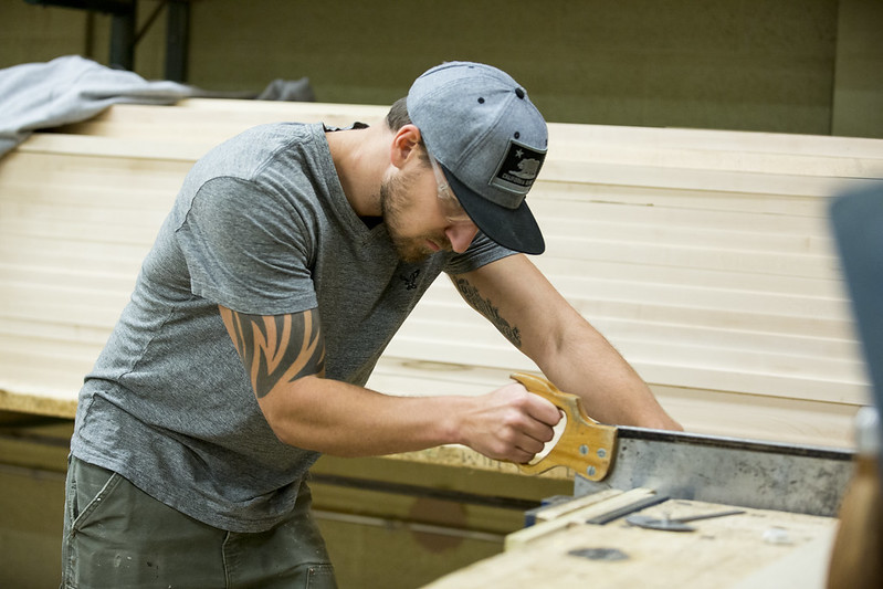 Man sawing wood