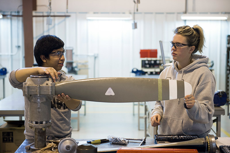 Two students working on a propellor 