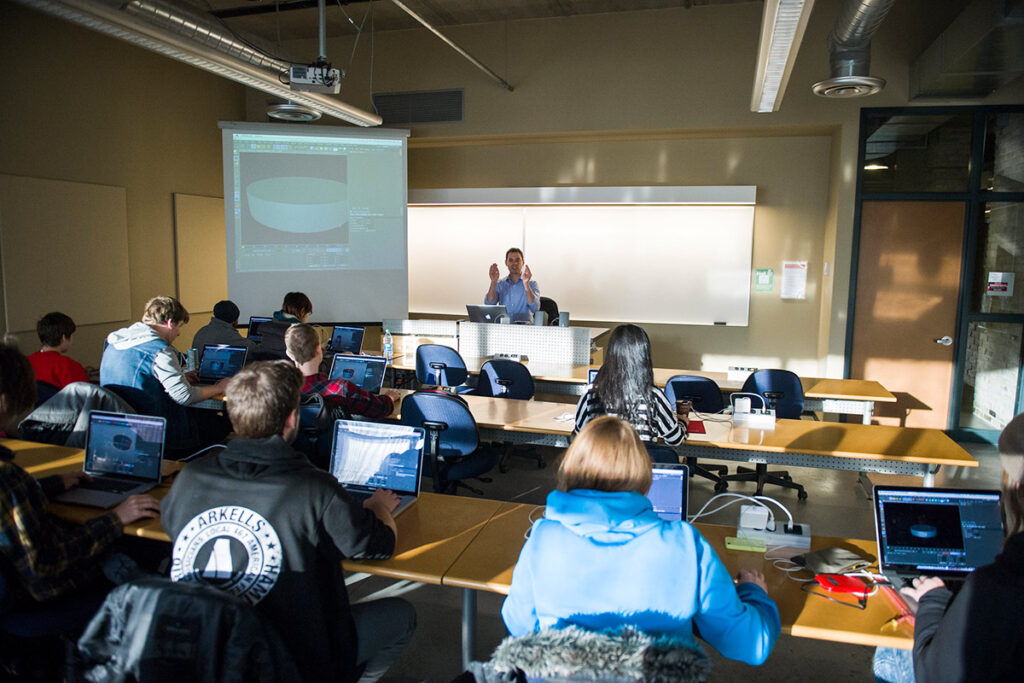 Instructor talking to a classroom full of students