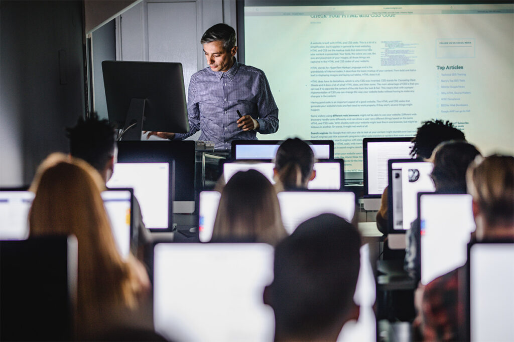 Instructor talking to a room full of students