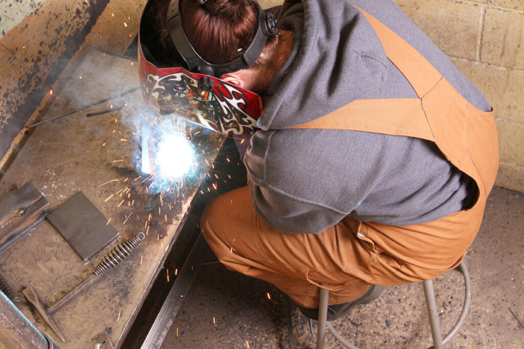 Student in a welding shop