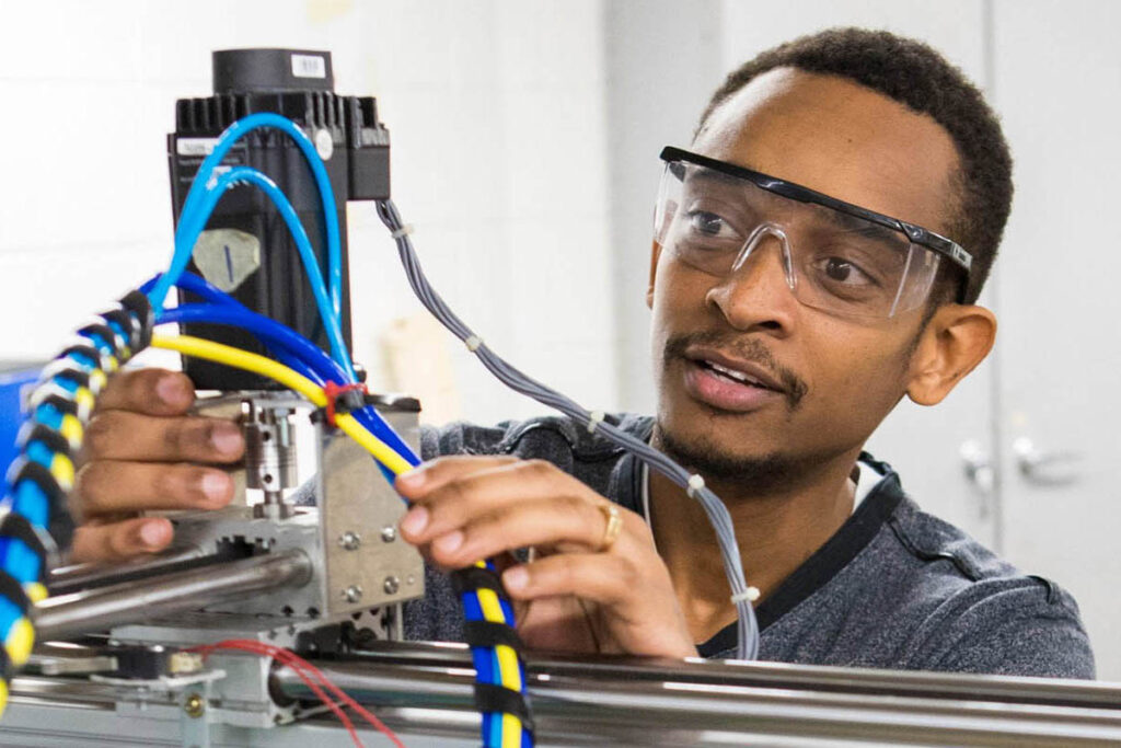 Man in factory working with machine