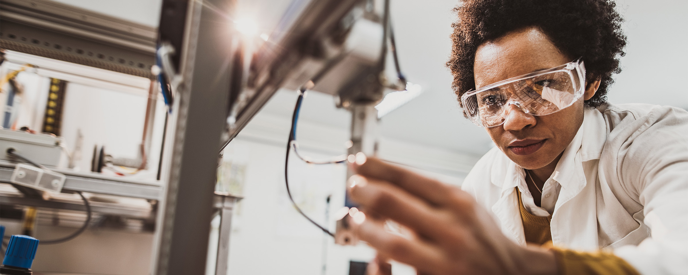 Woman working with advanced manufacturing tool