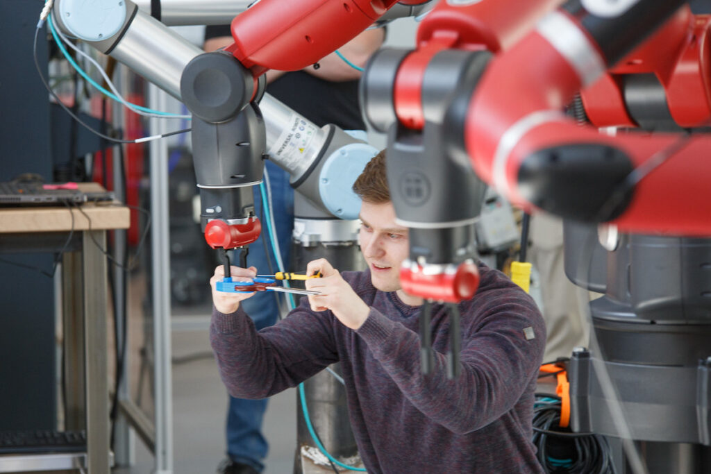 Man working with robot in demonstration