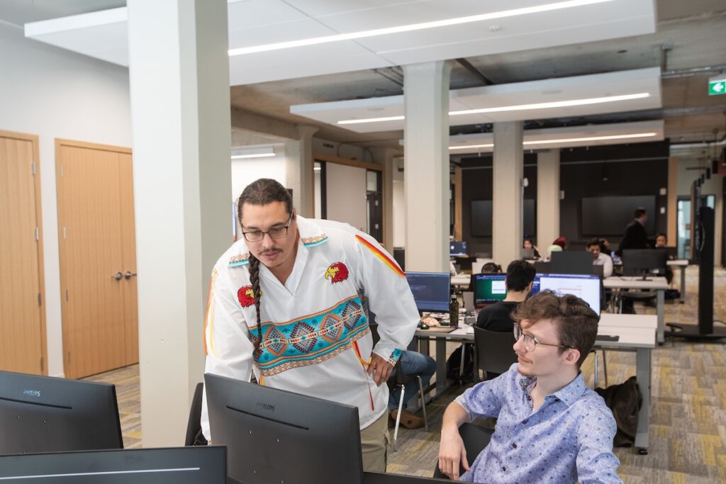Student working alongside entrepreneur-in-residence at the ACE Project Space