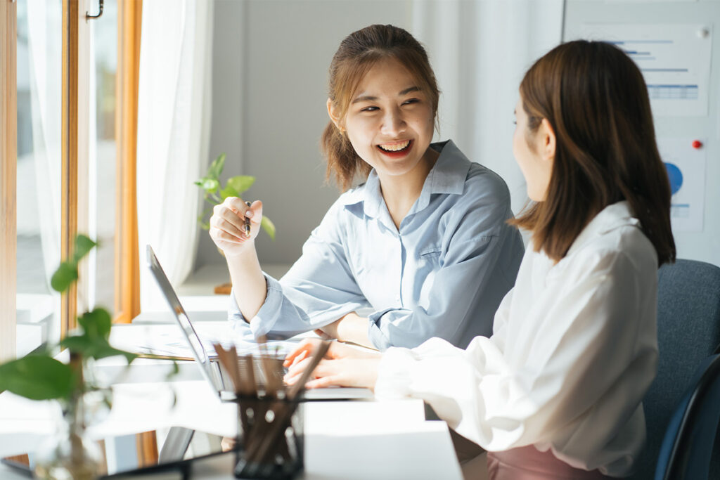 two businesswomen working together in an office