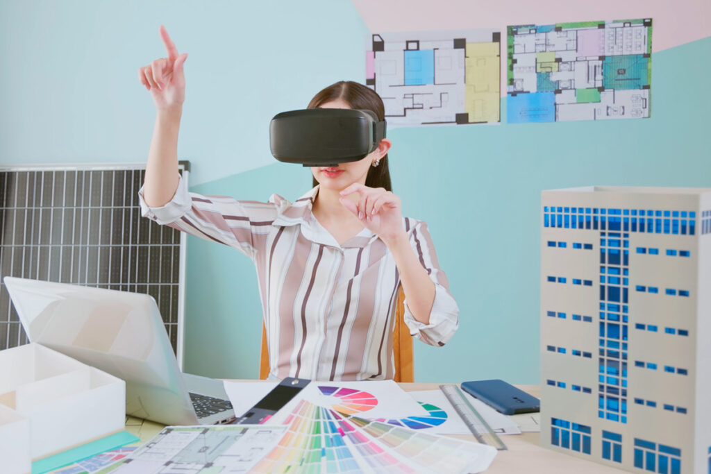 Interior decorator wearing vr headset technology to decorate the space.