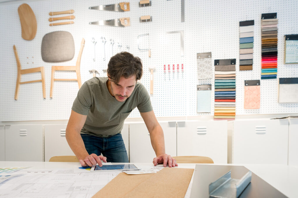 Male working on a sketch for a new project at his office.