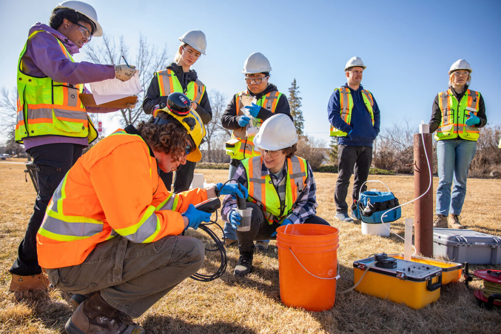 Students assess site features in preparation for site development
