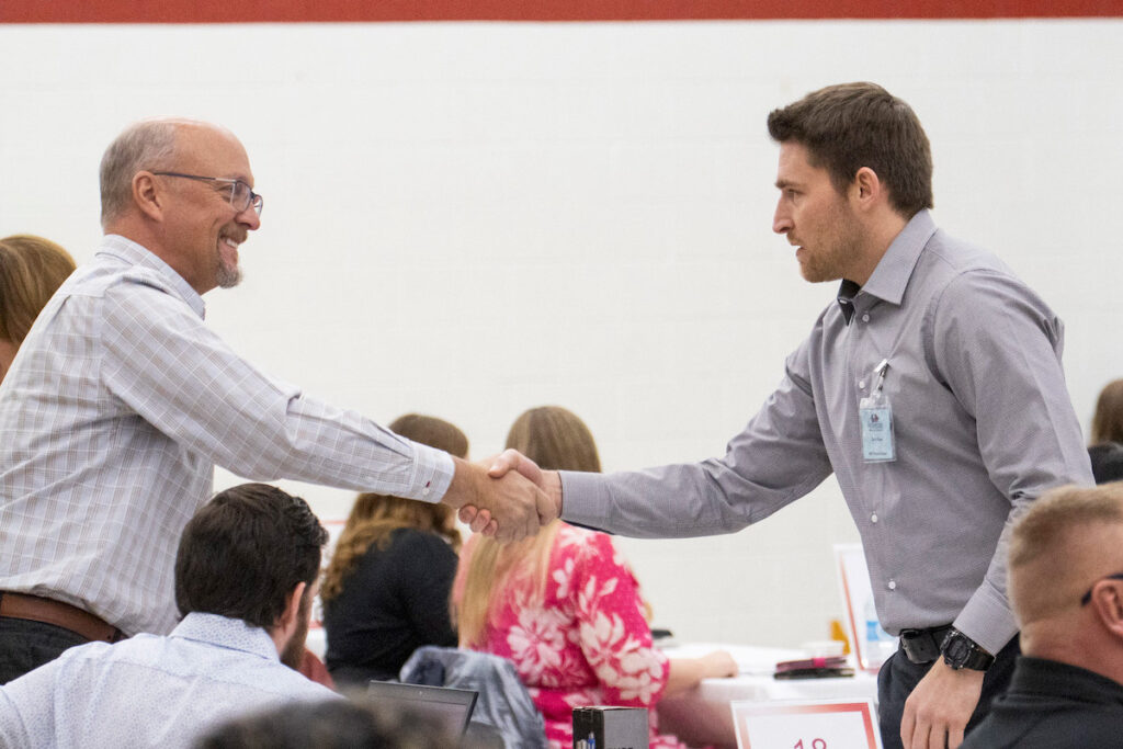 Students connecting with employers at an on-campus event.