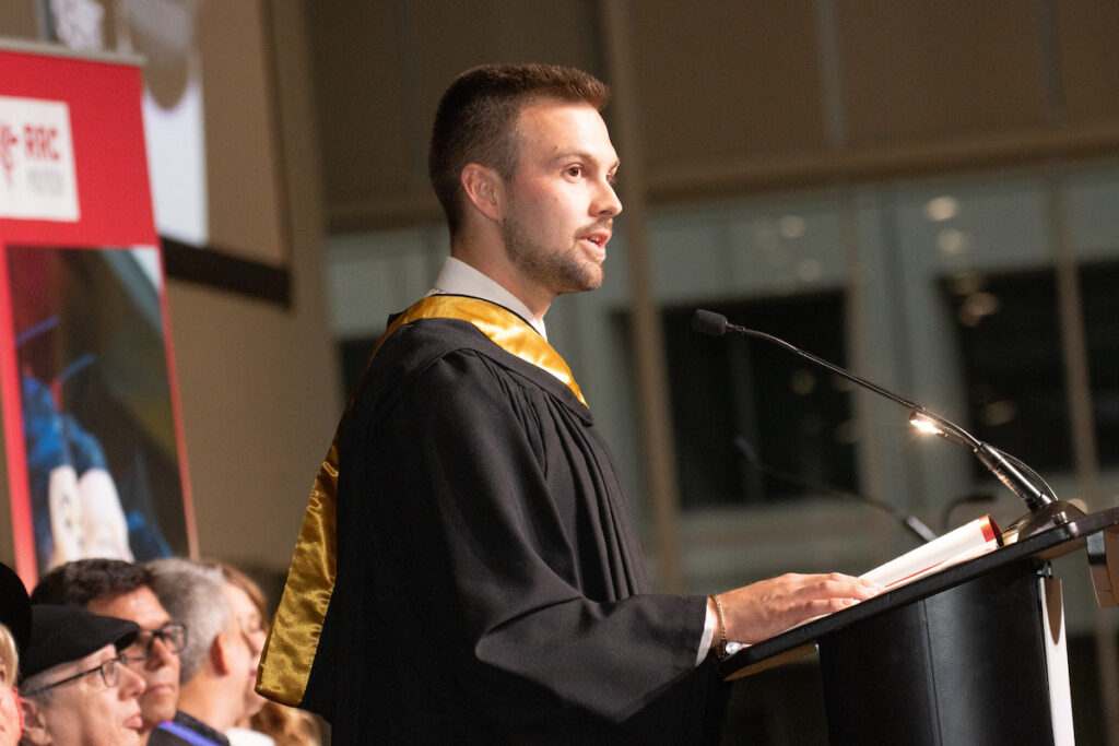 Graduate of the Civil Engineering Technology Department delivering an alumni address at RRC Polytech Convocation, 2025.