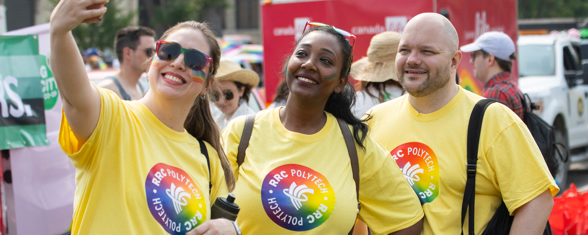 Group of people taking a selfie at a Pride parade
