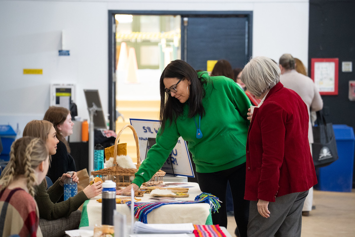 People interacting at Indigenous fair