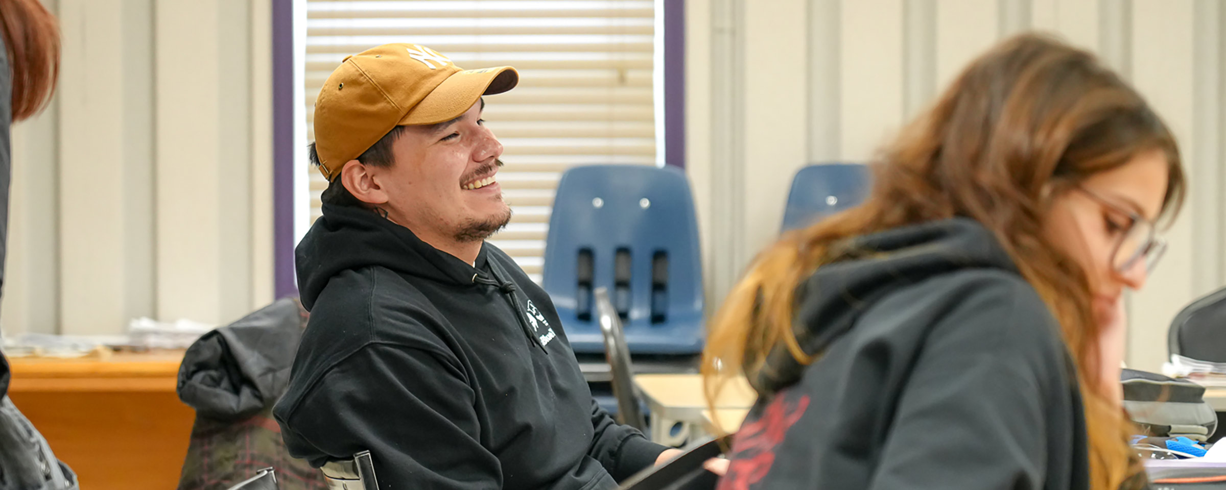 Smiling student in classroom