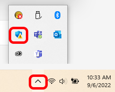 click hidden icons in taskbar and then click windows defender