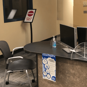 Service desk at NDC Library, with plexiglass