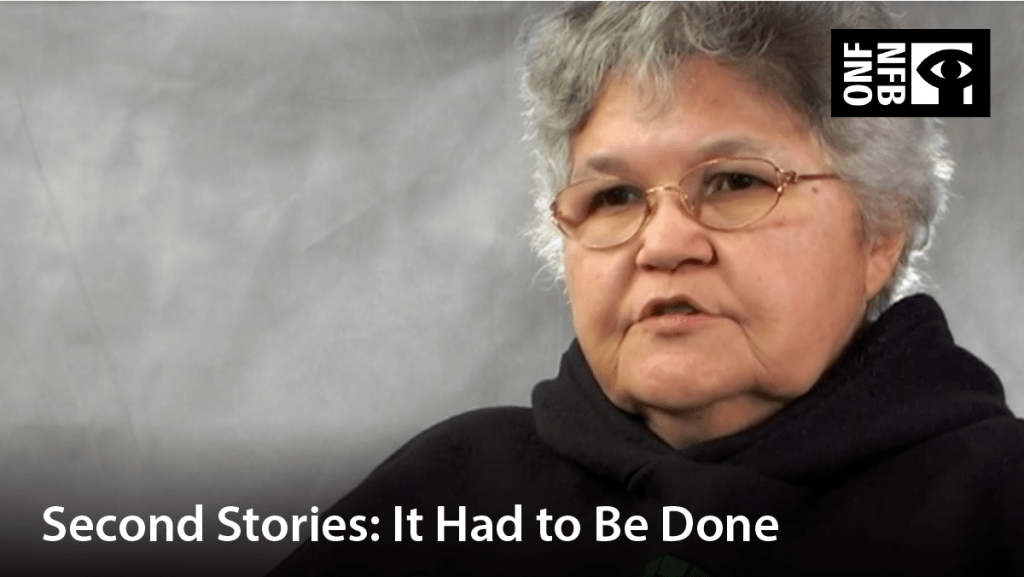 Indigenous woman with glasses, speaking. Film title: Second stories: it had to be done.