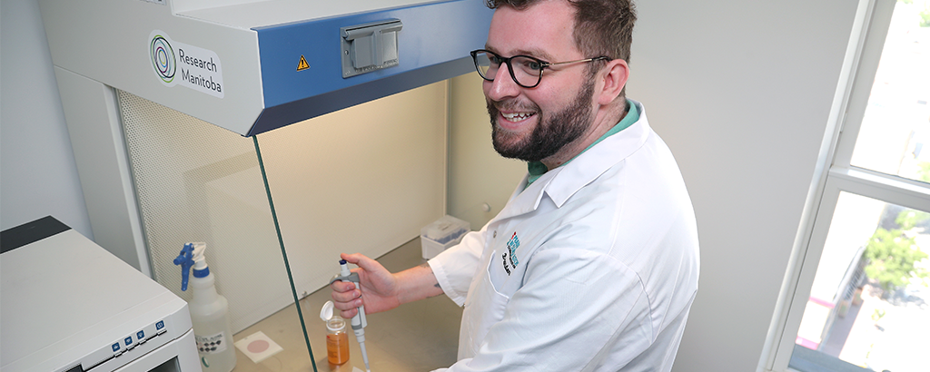 man in lab coat conducting research