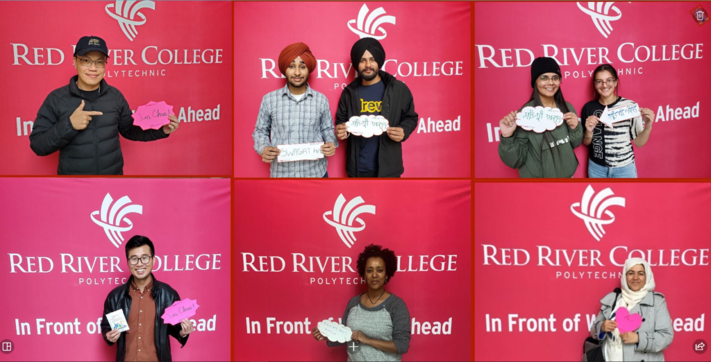 Students holding welcome signs in various languages in front of a Red River College Polytechnic backdrop.