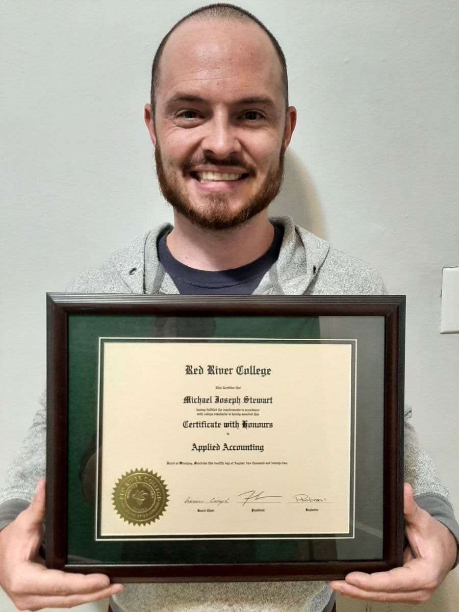 Student holding diploma