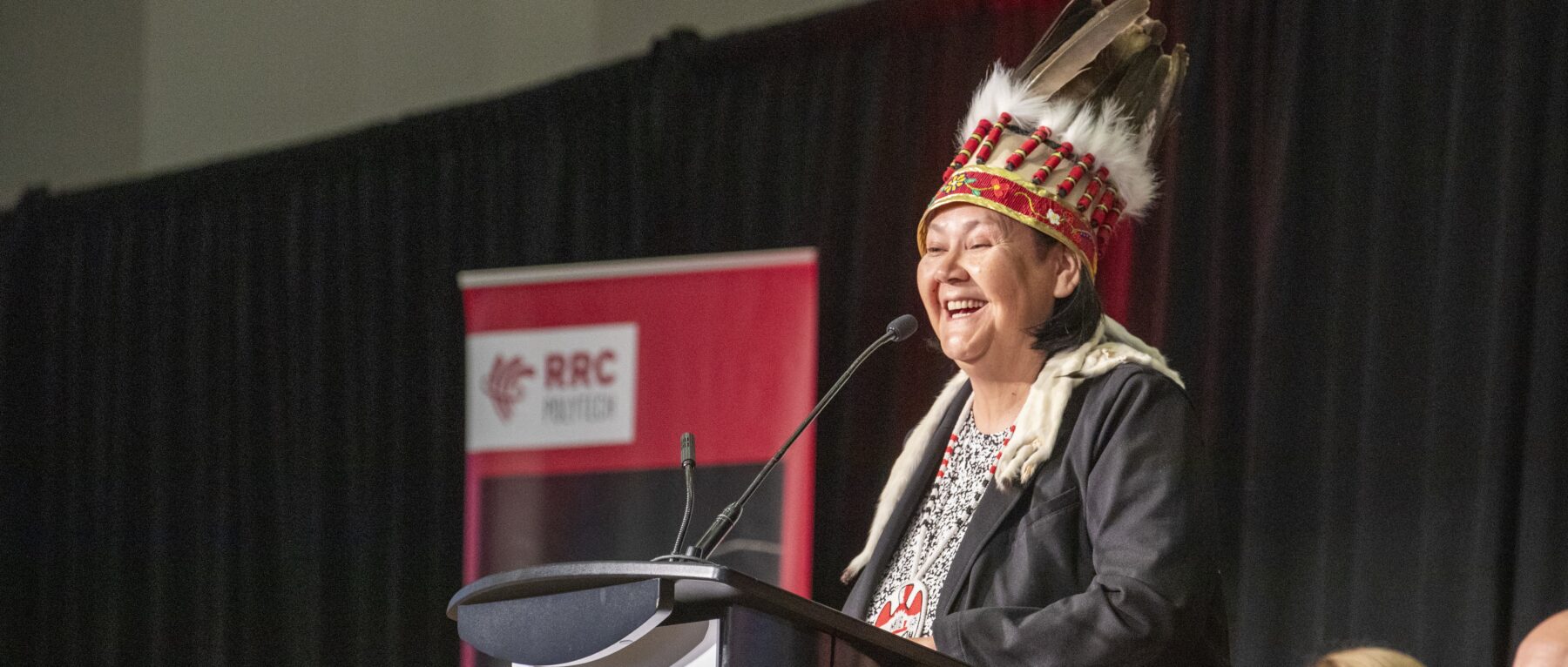 Grand Chief Cathy Merrick speaks to grads at RRC Polytech's Spring Convocation ceremony 2024