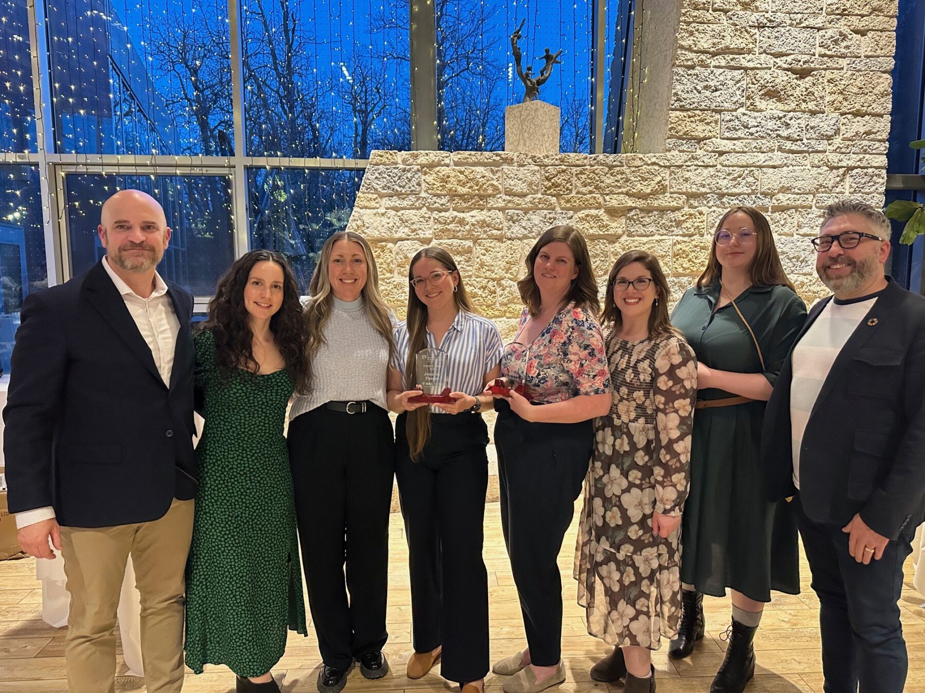 Communications team poses for a photo with awards at 2025 Manitoba Communicator of the Year Awards Ceremony on April 23, 2025 at the Qualico Family Centre