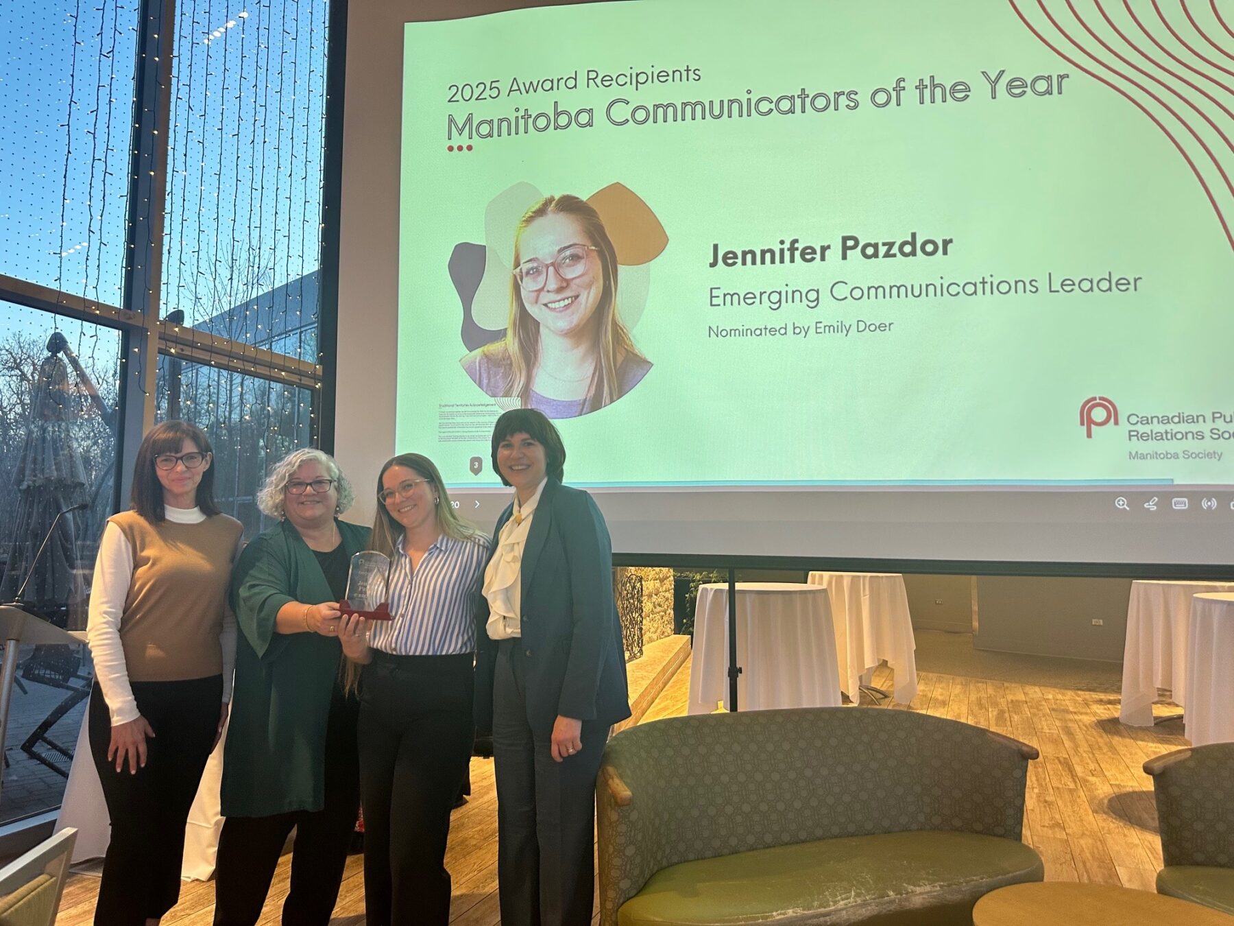 Jenn Pazdor accepts the award for Emerging Communications Leader at the 2025 Manitoba Communicator of the Year Awards Ceremony at the Qualico Family Centre