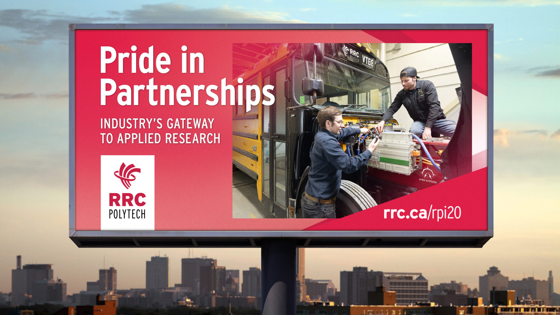 a billboard for RRC Polytech's pride in partnership campaign featuring technicians working on an electric school bus