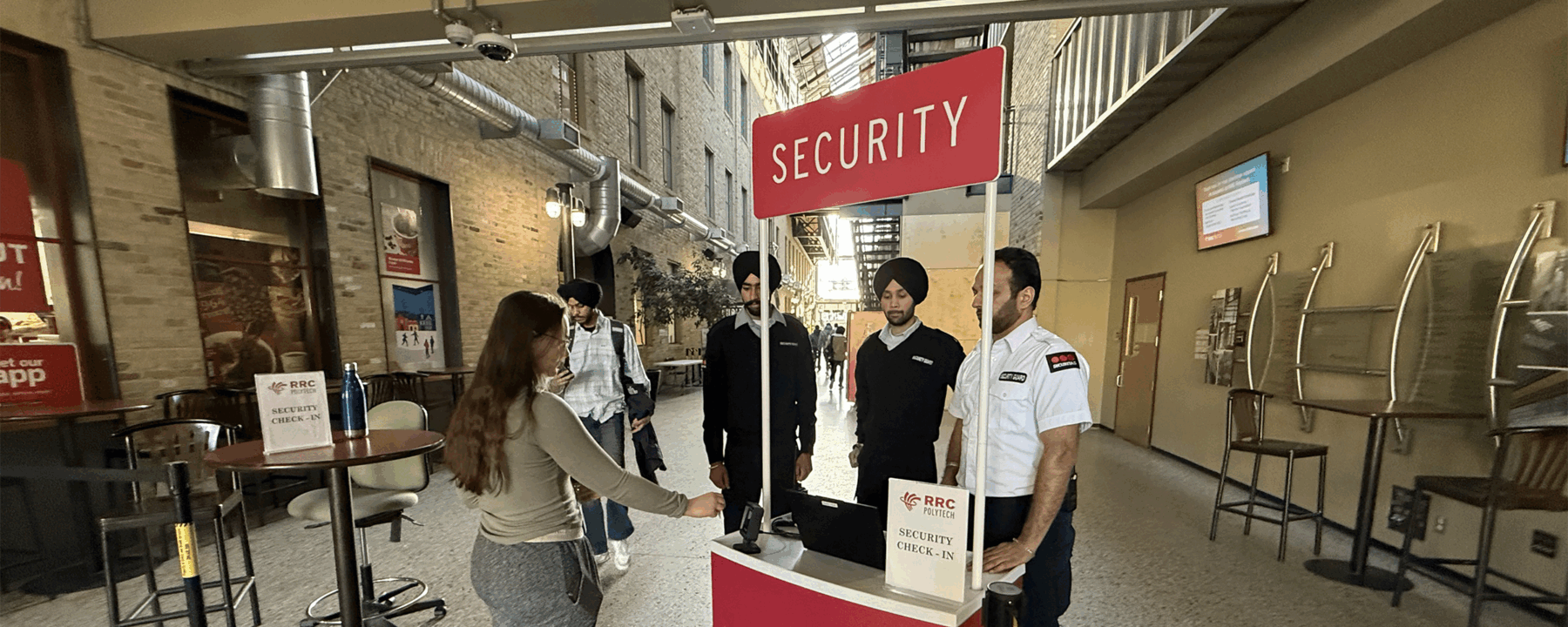 Person scanning their RRC Polytech ID card at a Security Booth